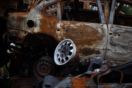 A bunch of wrecked and burned civilian cars in the city of Gostomel, Kyiv region