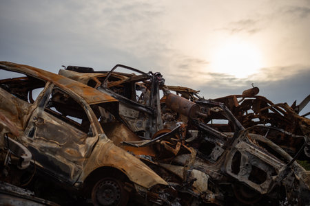 A bunch of wrecked and burned civilian cars in the city of Gostomel, Kyiv regionの写真素材