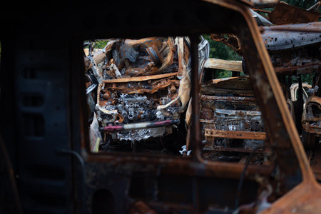A bunch of wrecked and burned civilian cars in the city of Gostomel, Kyiv regionの写真素材