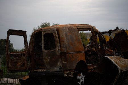 A bunch of wrecked and burned civilian cars in the city of Gostomel, Kyiv region