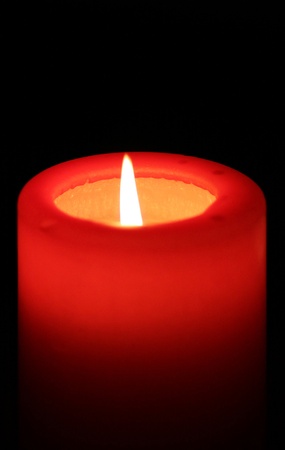 red candle with black background の写真素材