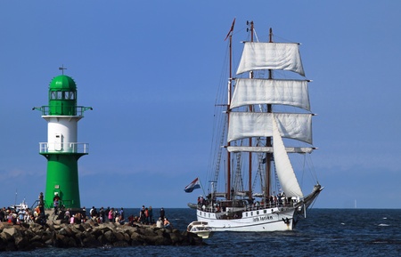 PORT WARNEMÜNDE, GERMANY - AUGUST 13: Cruise of an old Sailing ship on August 13, 2011 during the 21st annual Hanse-Sail event in Port Warnemunde, Germany 03のeditorial素材