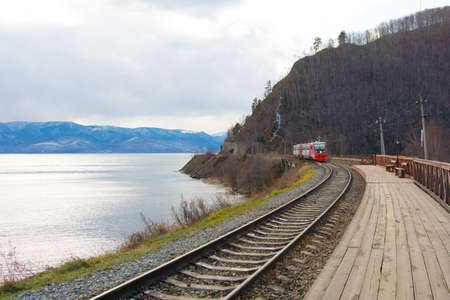 Circum Baikal railway and train. Circum-Baikal railway and train arriving at Slyudyanka station.の写真素材