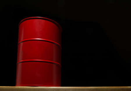 Red barrel of oil on a black background for design.の写真素材