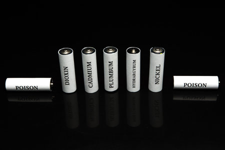 Battery on a black background. Battery for charging. Ecology. Harm to nature from batteries.の写真素材