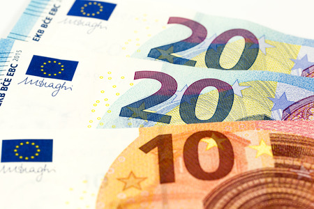 some euro bank notes and coins