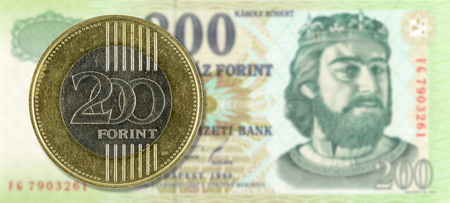200 forint coin against 200 hungarian forint bank note obverseの写真素材