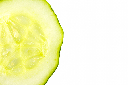 slice of fresh organic pickling cucumbers isolated on white backgroundの写真素材