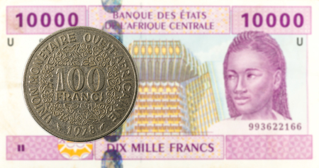 100 central african CFA franc coin against 10000 central african CFA franc bank note obverseの写真素材