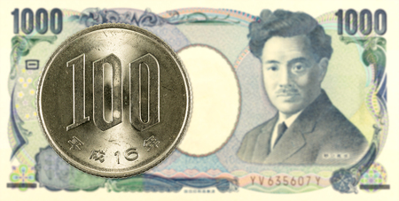 100 japanese yen coin against 1000 japanese yen bank note obverseの写真素材