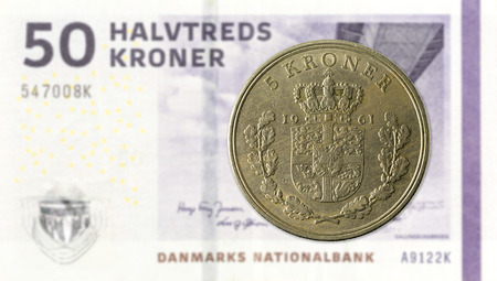 5 danish krone coin against 50 danish krone noteの写真素材