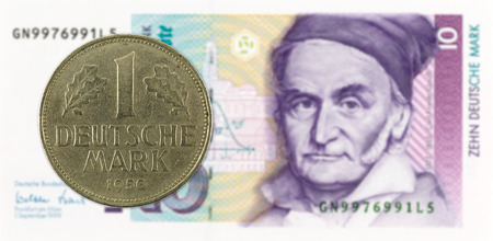 1 german mark coin against 10 german mark bank noteの写真素材