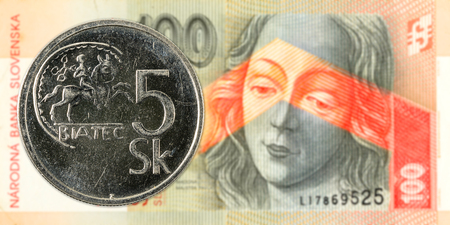 5 slovak koruna coin against 100 slovak koruna banknote obverseの写真素材