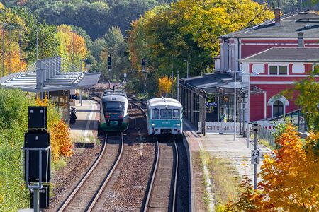 Loebau, Saxony, Germany - 10.12.2019; a historic and a modern regional train waiting at Loebau railway stationのeditorial素材
