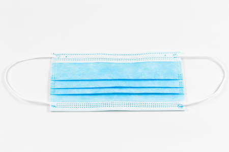 a single surgical masks isolated on white background