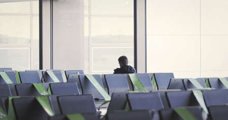 Frankfurt, Hesse/Germany - November 2nd 2020: Frankfurt am Main Airport is a major international airport and is almost empty compared to previous years. Few people travelling, lots of closed gates.のeditorial素材