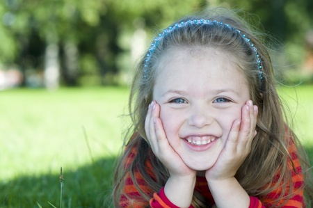 Portrait of little girl in the parkの写真素材