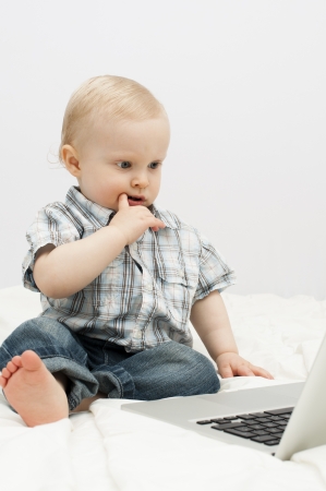 Little child and  laptopの写真素材