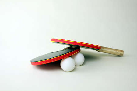tennis table paddles and balls on white background.の写真素材