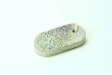 Pumice scrub stone for bathing and skincare, isolated on white.の写真素材