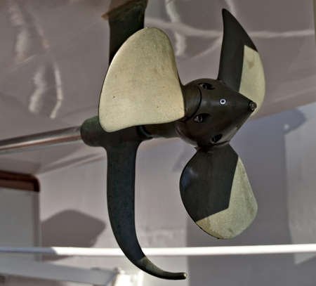 Close up of a ships propeller sitting on land.の写真素材