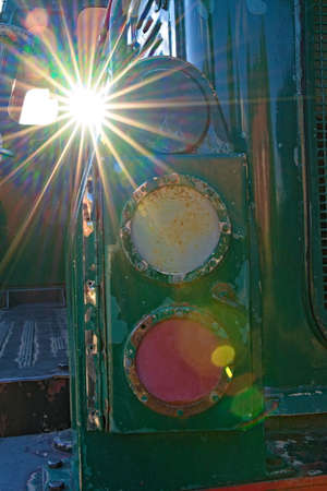 Worn headlights on an old diesel locomotive, close up.