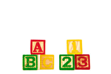 Colored letter cubes made from wood spelling ABC and 123 to illustrate the concept of learning....