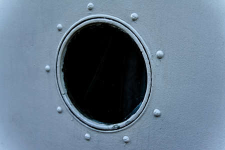 Port hole on a riveted steel ship.の写真素材