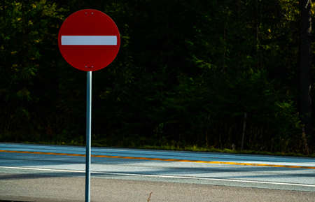 Stop or not allowed red and white road sign on the side of a highway. . High quality photo