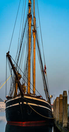 Classic old wooden tall ship moored at port in the morning light. . High quality photoの写真素材