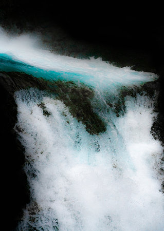 Waterfall dropping of a cliffs edge with turquoise water and white foam. Close up isolated on black. . High quality photoの写真素材