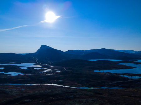 Mount Bitihorn in Jotunheimen national park in Norway. In sharp contrast to a bright sun.の写真素材