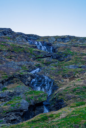 Waterfall free falling from a steep mountain slope. . High quality photoの写真素材