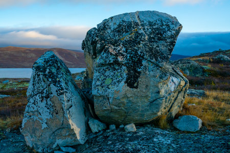 Massive boulder in the mountains cracked open by the frost. . High quality photoの写真素材