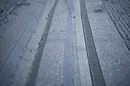 Cross country skiing tracks in the snow, close up with shallow depth of field. High quality photoの写真素材
