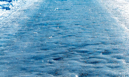 Slippery icy road in the middle of winter. Shallow depth of field. High quality photoの写真素材
