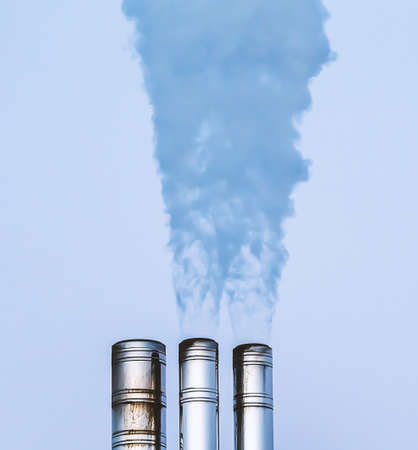 Industrial smokestack sending out hot white steam and smoke. Close up. High quality photoの写真素材