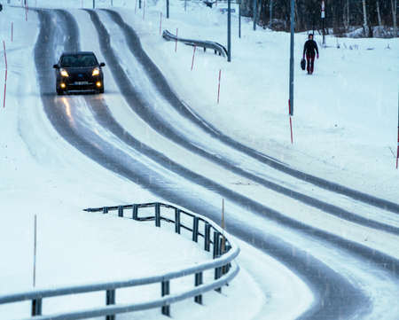 Traffic on a snow covered winter road. High Quality image.の写真素材
