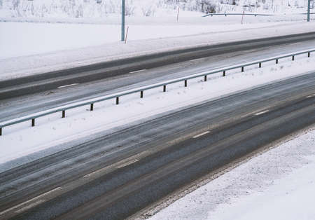 Highway covered in snow during a blizzard. No cars or traffic.の写真素材