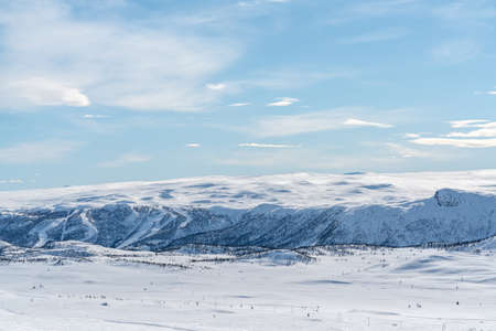 Spectacular view over snow covered valleys and mountains during winter. High quality photoの写真素材