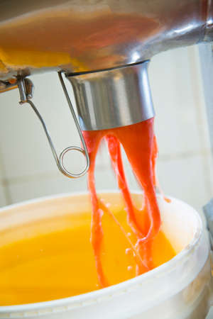 manufacture of tomato sauce, sauce out of the machine for pottingの写真素材