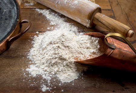 rolling pin and flour on the wooden table