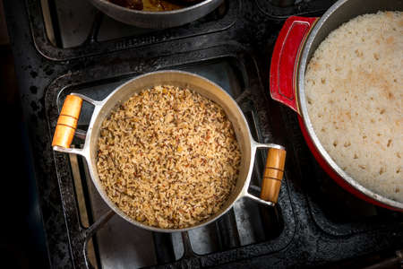 Healthy food pan with brown rice on stove. top viewの写真素材