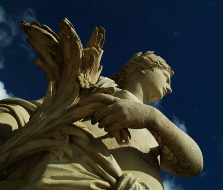 Statue over blue skyの写真素材