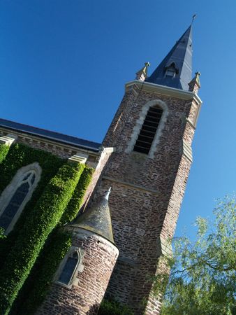 Church bell tower and blue skyの写真素材