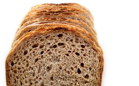 Slices of brown bread on a white background