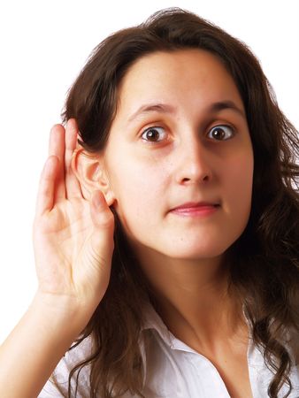 Girl listening with her hand on an earの写真素材