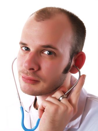 Young doctor using a stethoscope and smilingの写真素材