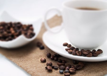 Coffee beans on a coffee cup