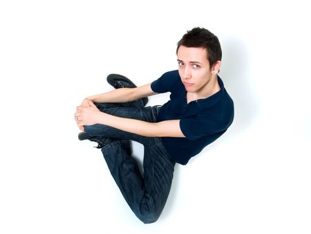 Happy young man posing on a white backgroundの写真素材